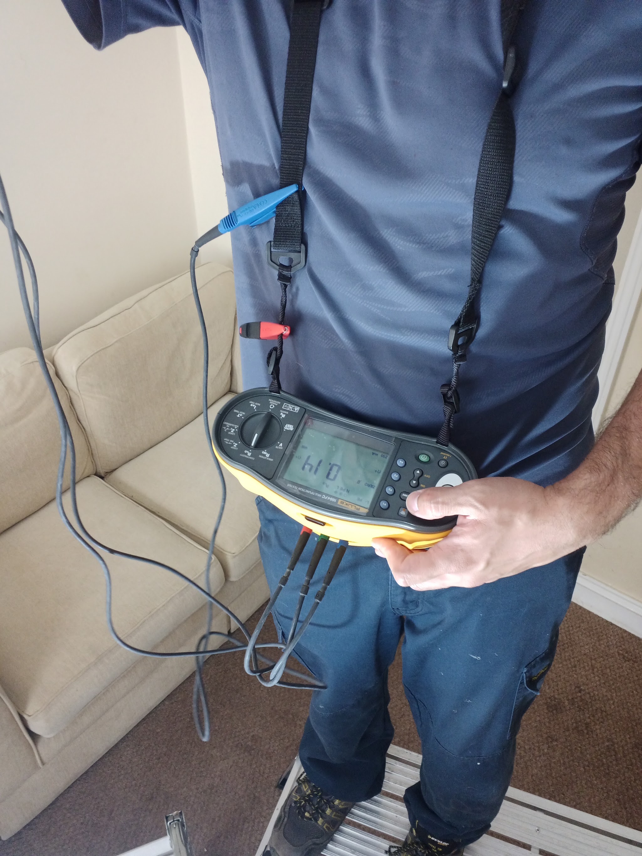 Close-up of an installation tester in hand during testing