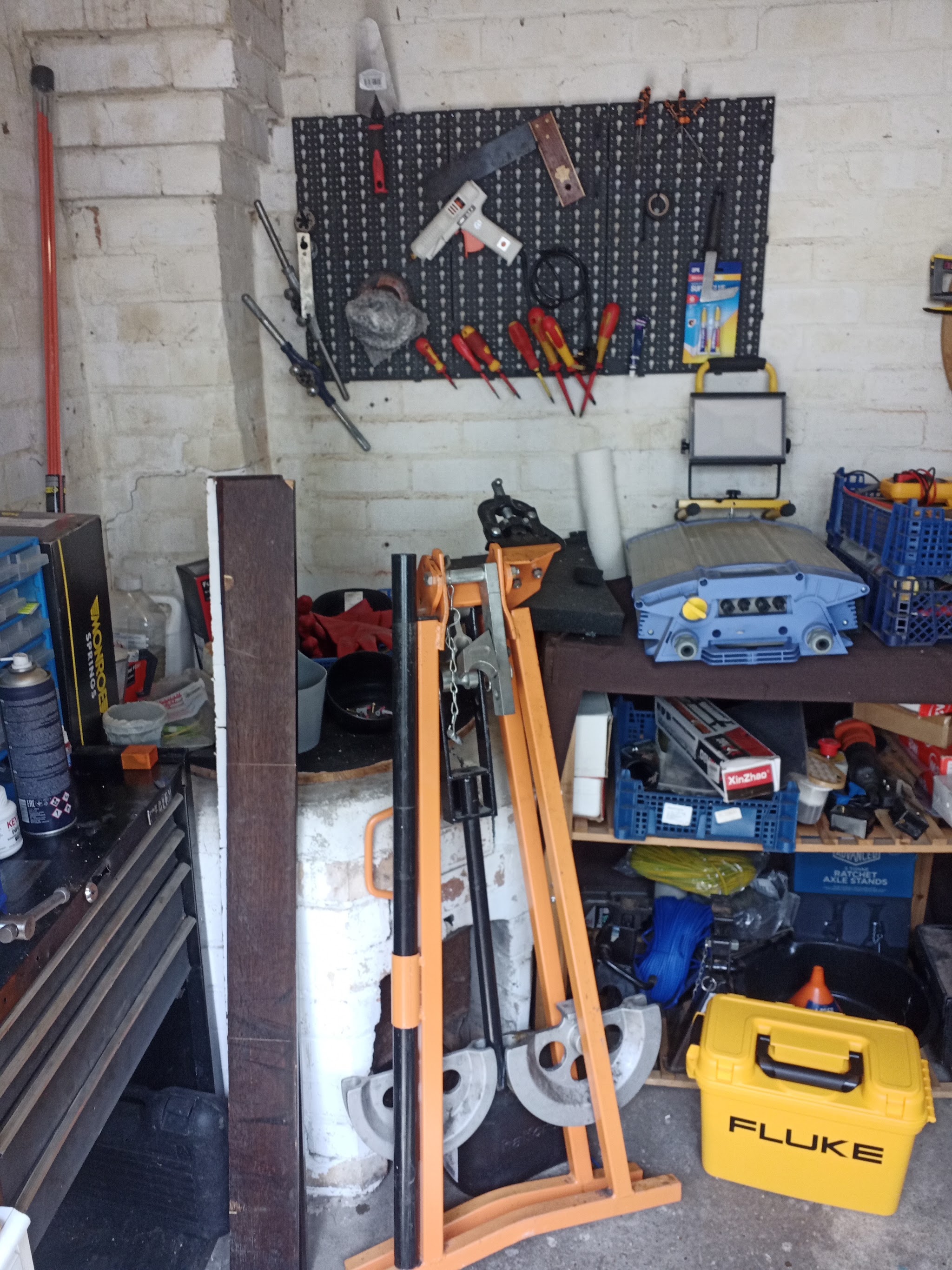 The workshop wall: tool board, test kit case and conduit bending tools