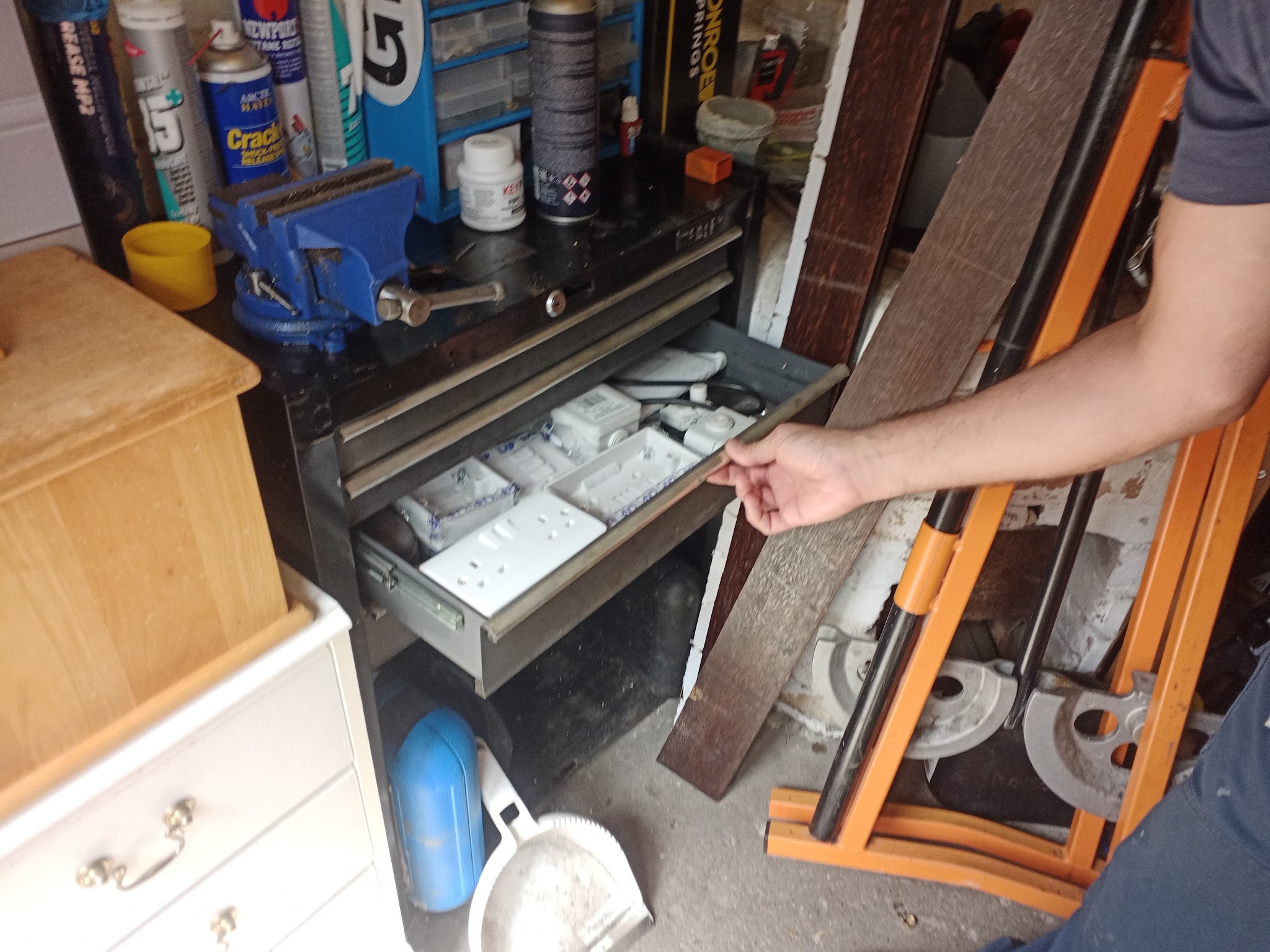 A tool chest drawer of electrical fittings being pulled open
